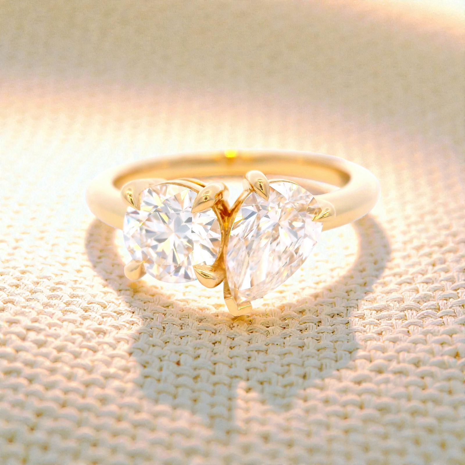 Round and Pear Shaped Diamonds Set in Yellow Gold