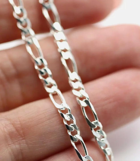 SS BEVELLED DIAM CUT FIGARO CHAIN