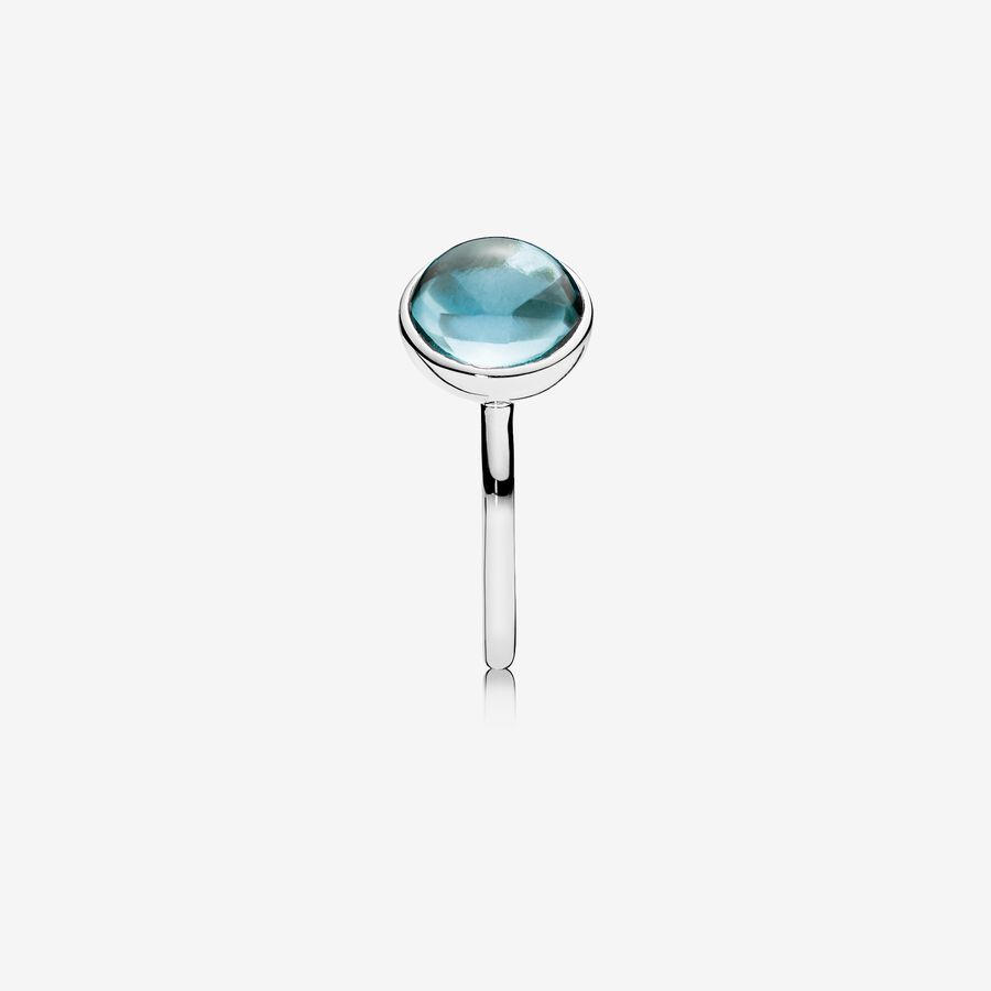 Silver ring with aqua blue crystal