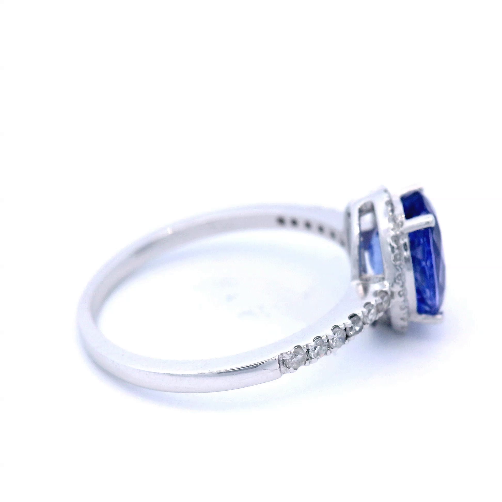 Oval Cut Tanzanite Dress Ring with Diamond Halo and Shoulder in White Gold