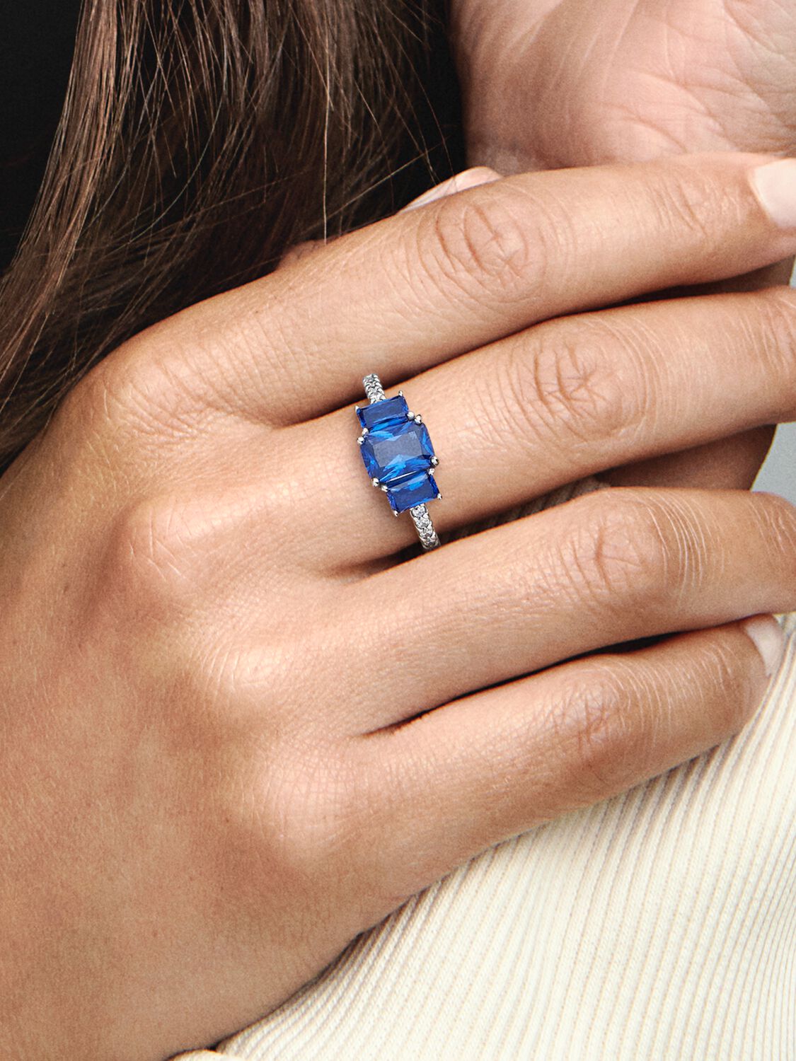 Sterling silver ring with princess blue crystal and clear cubic zirconia