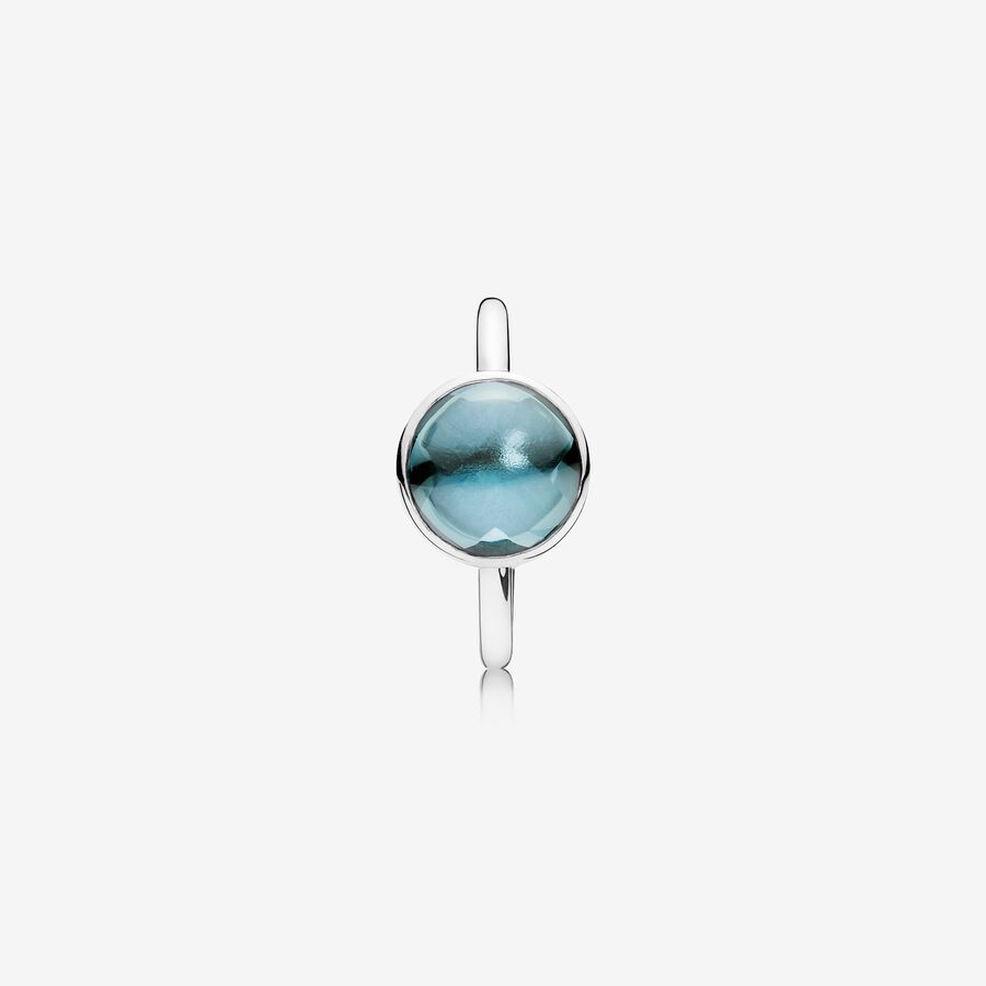 Silver ring with aqua blue crystal