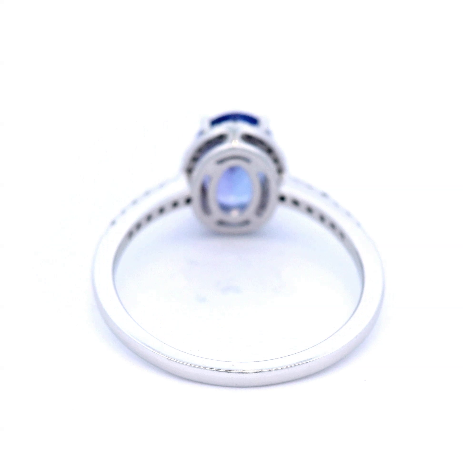 Oval Cut Tanzanite Dress Ring with Diamond Halo and Shoulder in White Gold
