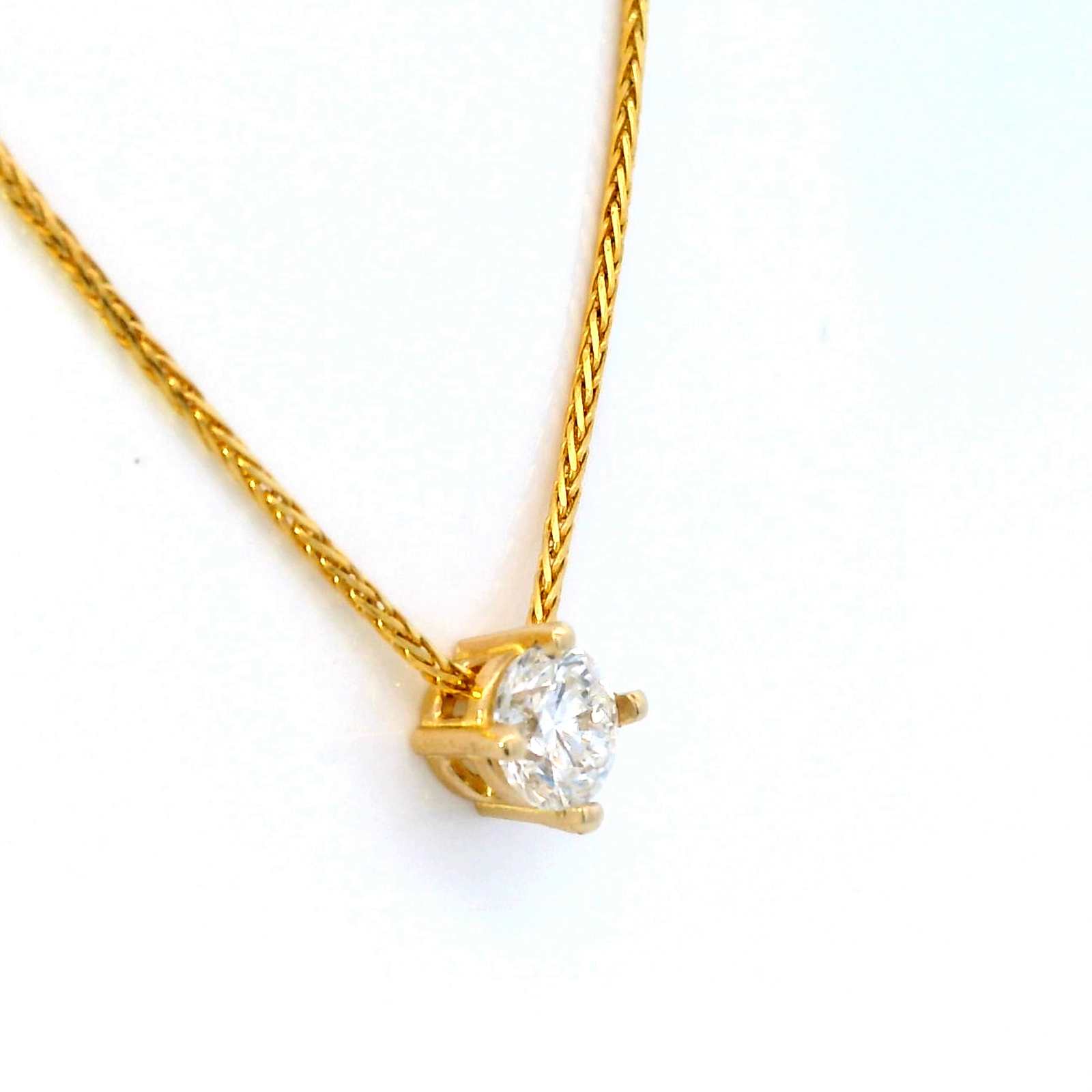 Diamond Slider Pendant on Yellow Gold Wheat Chain.