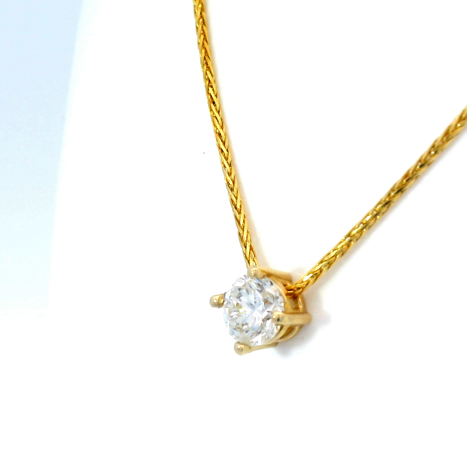 Diamond Slider Pendant on Yellow Gold Wheat Chain.