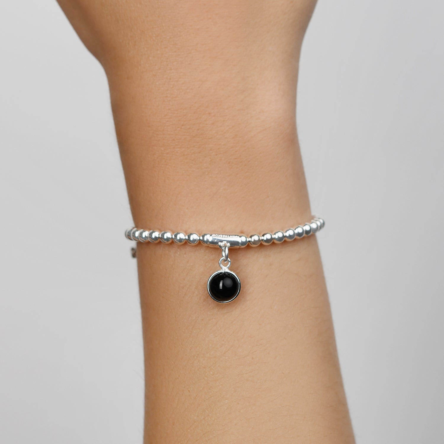 Sterling Silver 4mm Stretchy Ball Bracelet With 8mm Round Black Onyx Bead Charm.