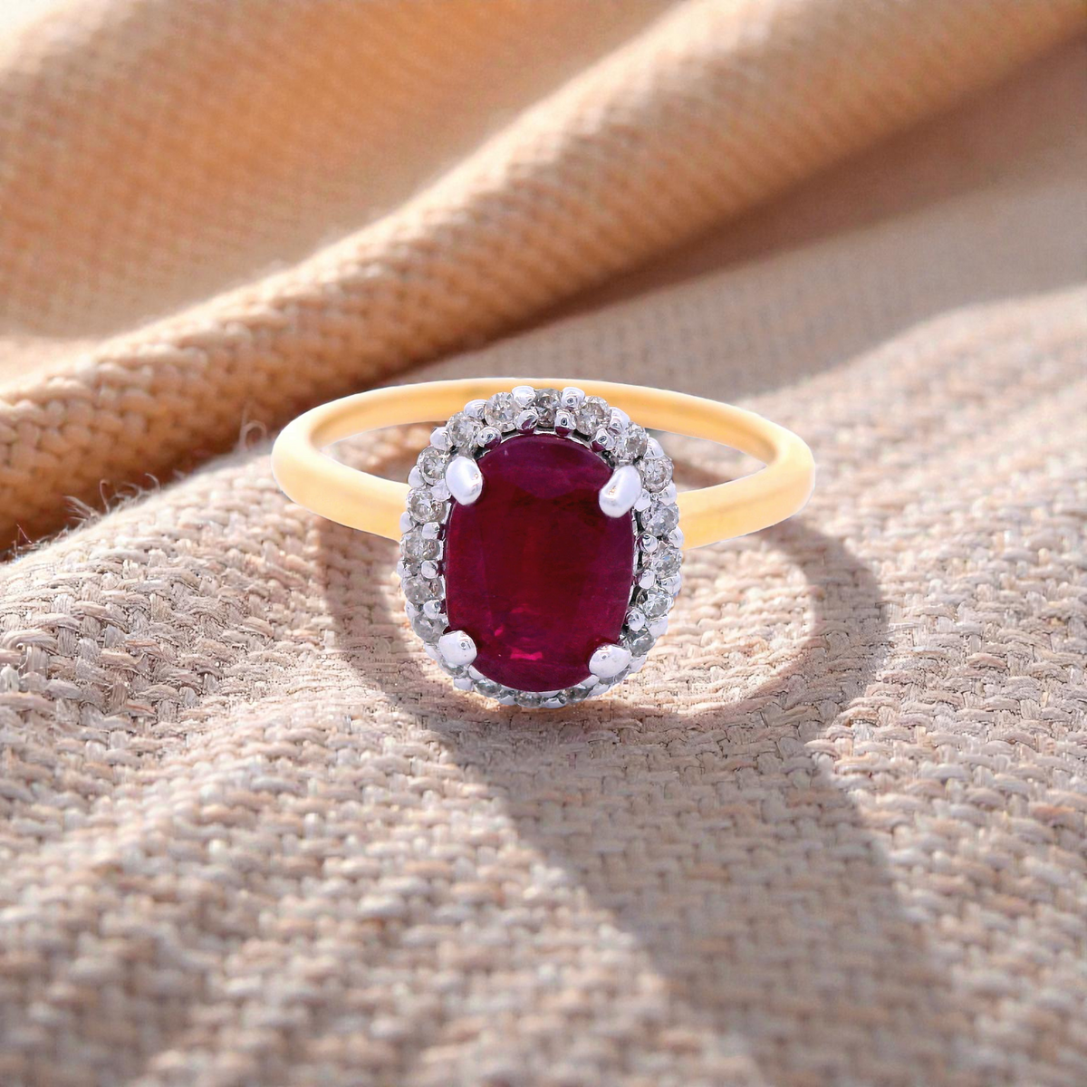 Oval Shaped Ruby with Diamond Halo Cluster in Yellow Gold