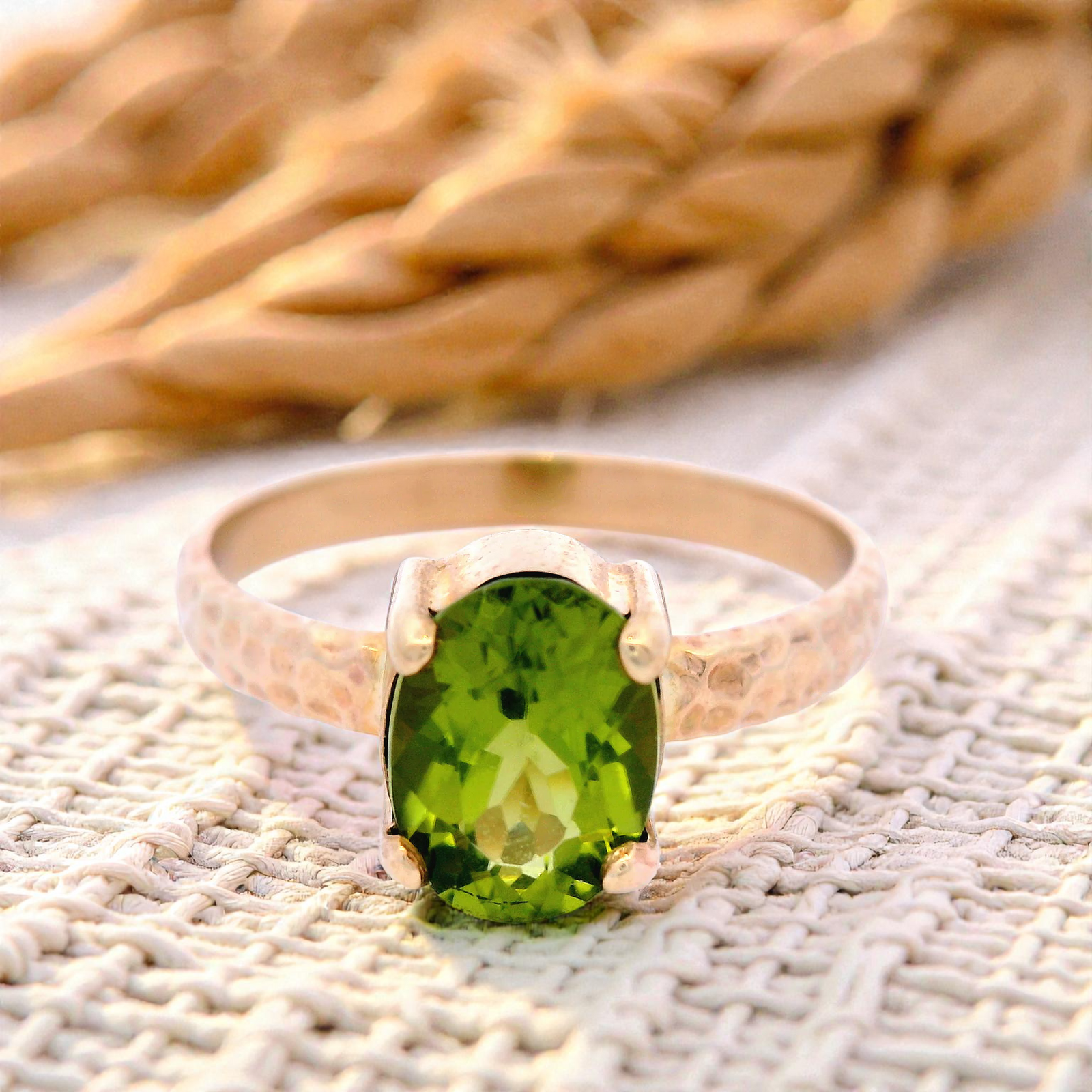 Oval Peridot in a 4 Claw Setting and Hammered Detail Band
