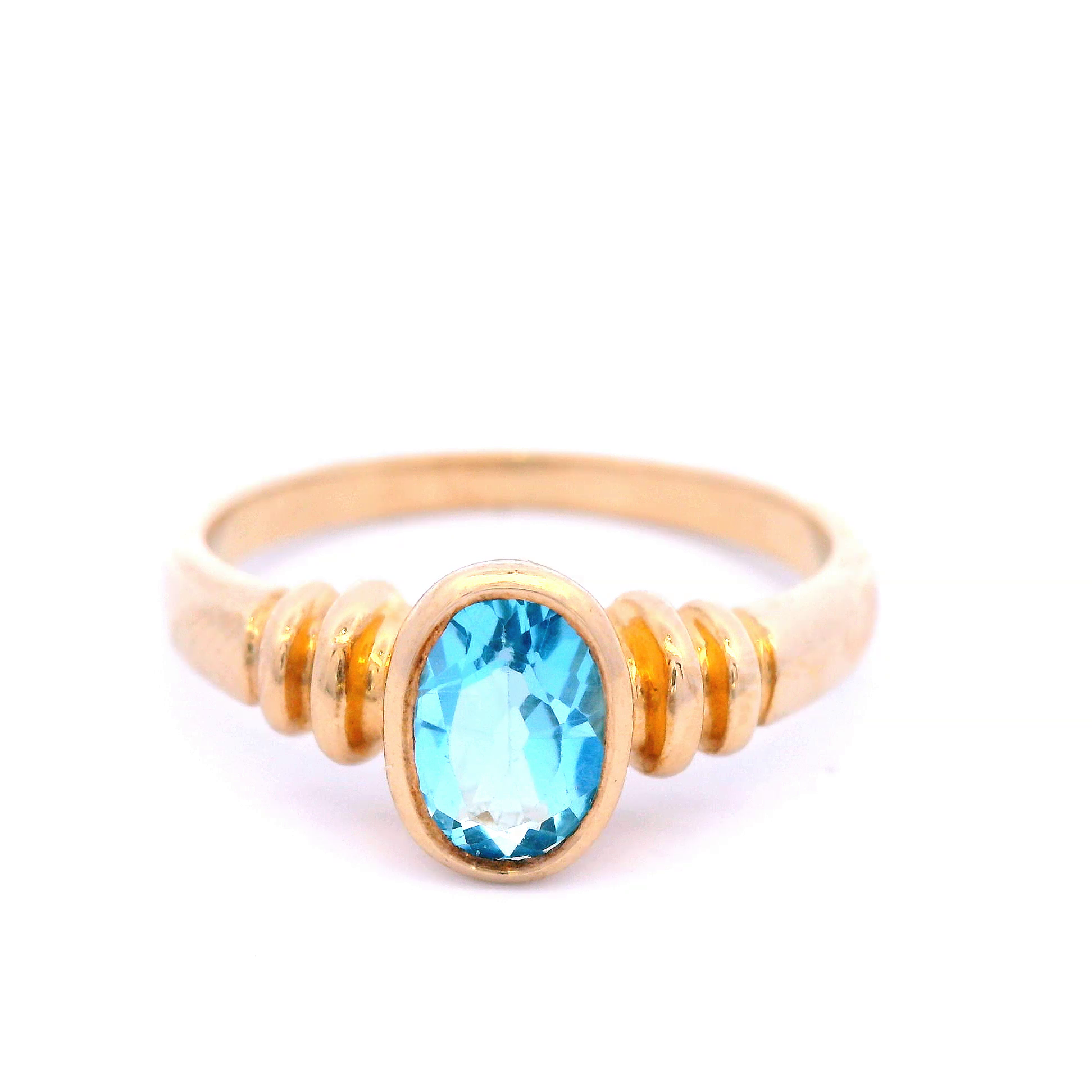 Oval Blue Topaz Set in Yellow Gold