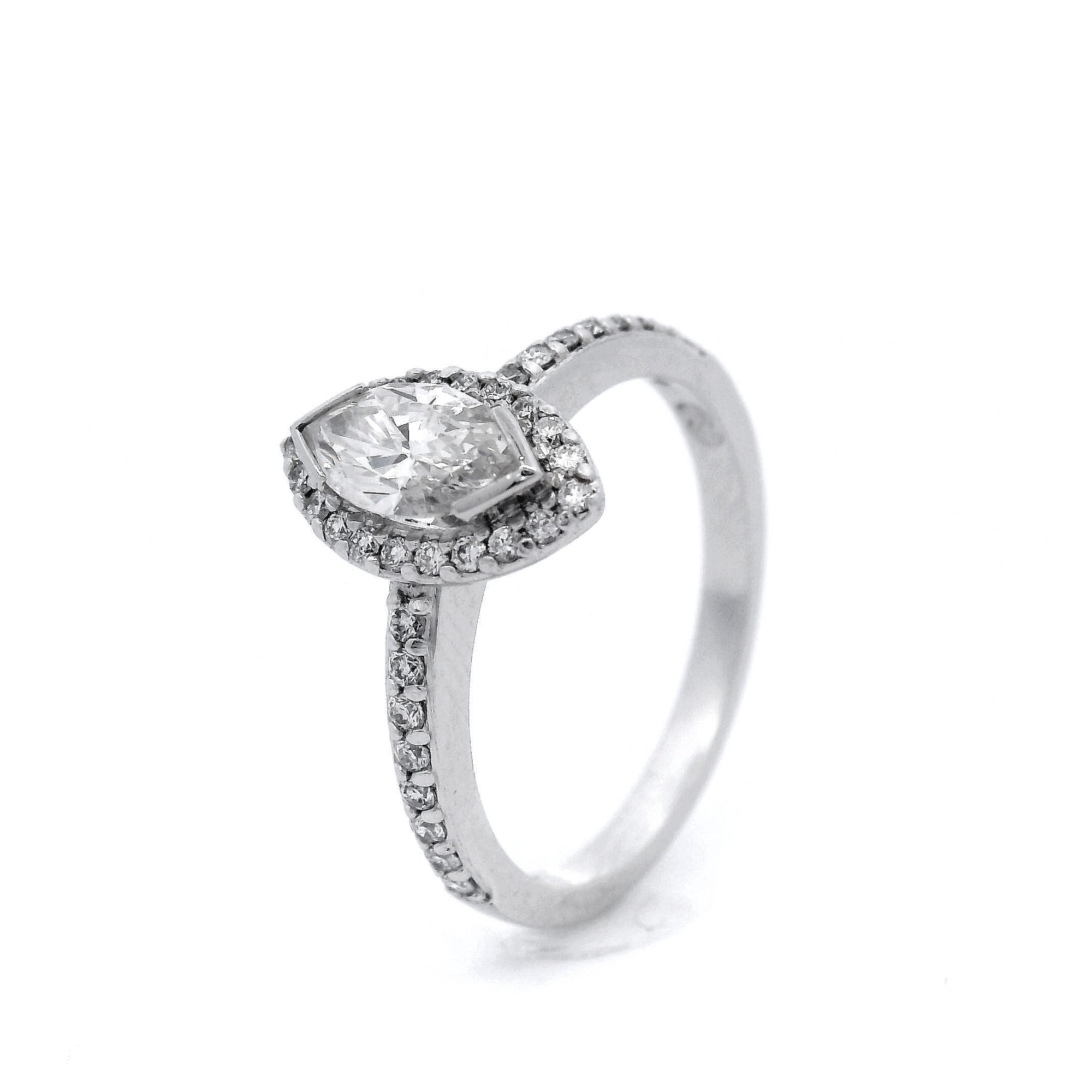 Marquise Diamond and Diamond Halo Engagement Ring in 18 Carat White Gold