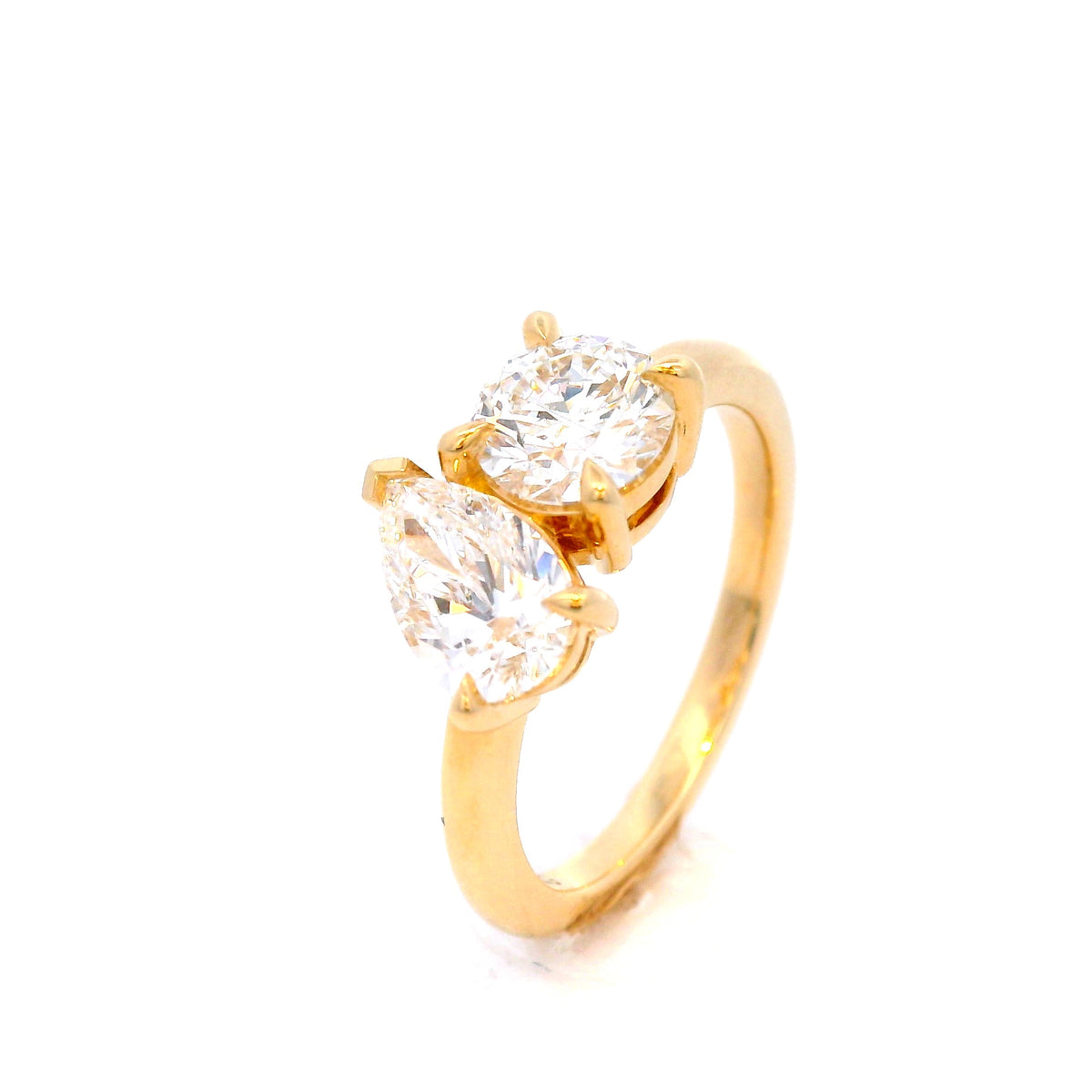 Round and Pear Shaped Diamonds Set in Yellow Gold