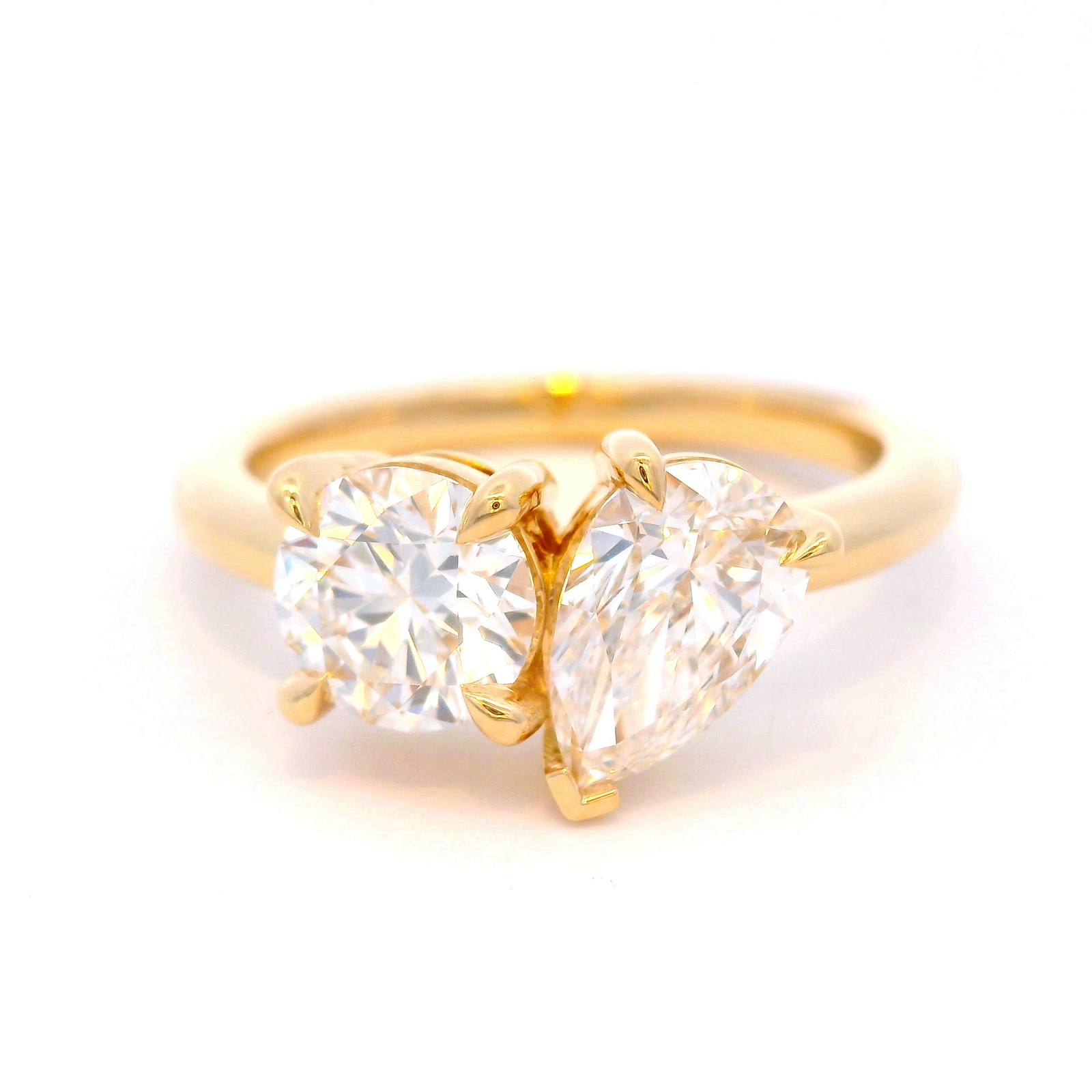 Round and Pear Shaped Diamonds Set in Yellow Gold