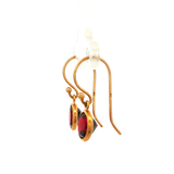 Round faceted Garnet Earrings in Yellow Gold