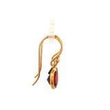 Round faceted Garnet Earrings in Yellow Gold