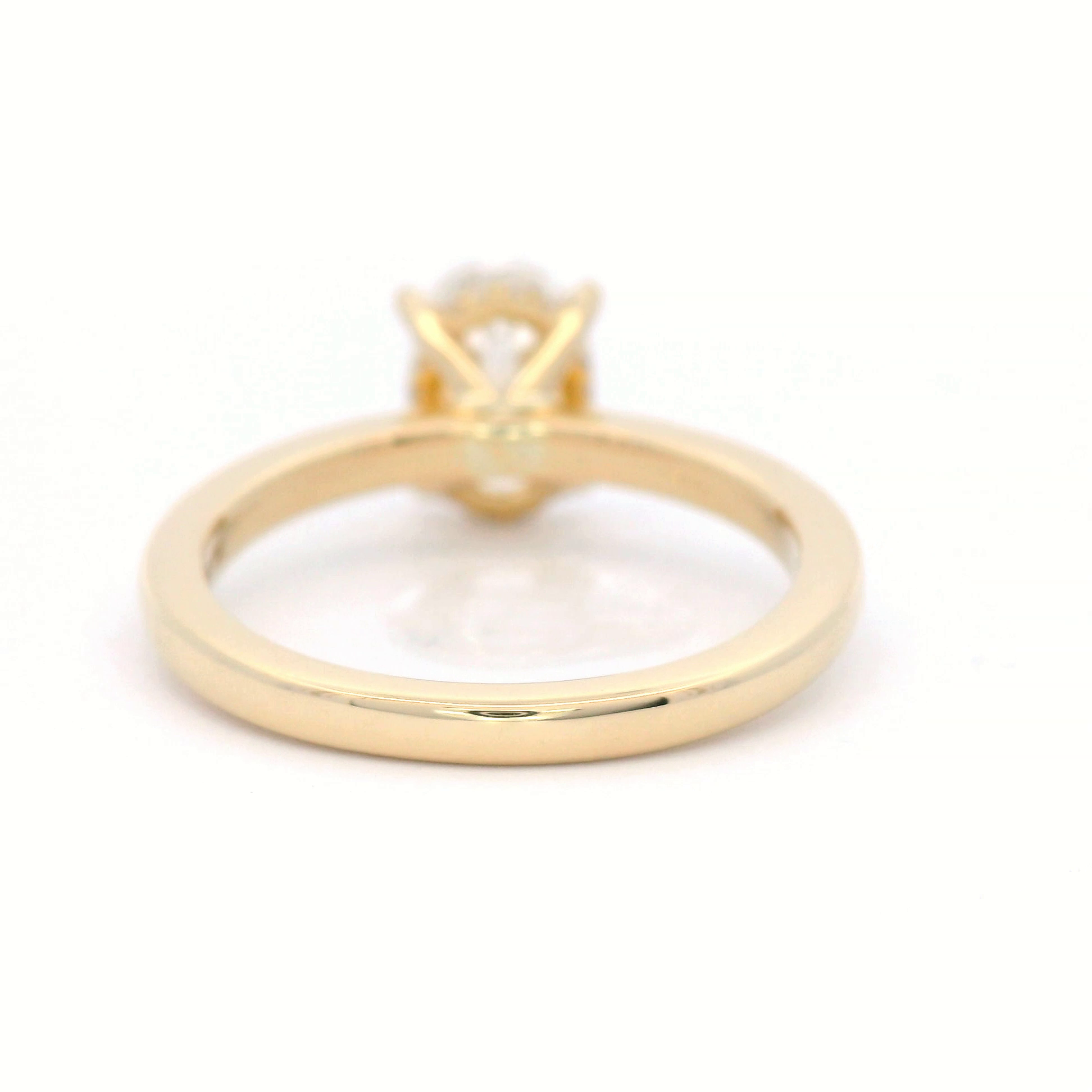 Lab Grown Oval Cut Diamond Engagement ring with hidden diamond set halo in 18 Carat Yellow Gold