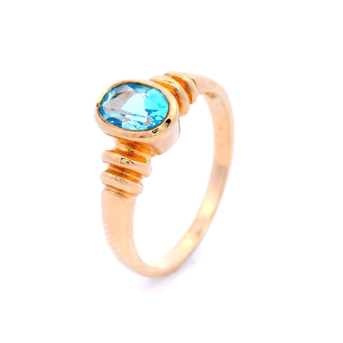 Oval Blue Topaz Set in Yellow Gold