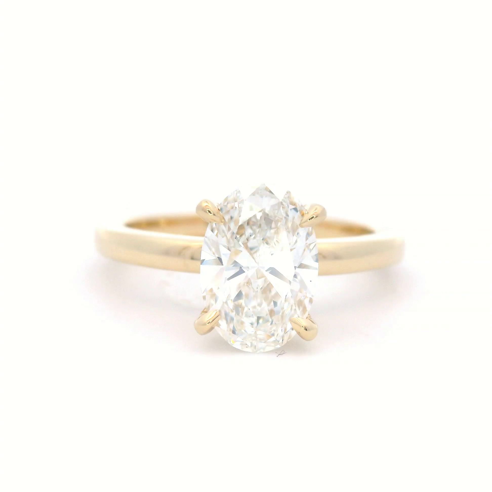 Lab Grown Oval Cut Diamond Engagement ring with hidden diamond set halo in 18 Carat Yellow Gold