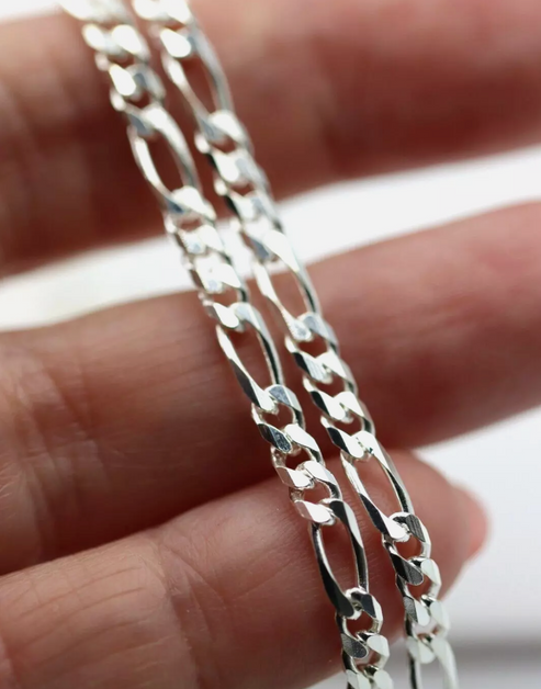 SS BEVELLED DIAM CUT FIGARO CHAIN
