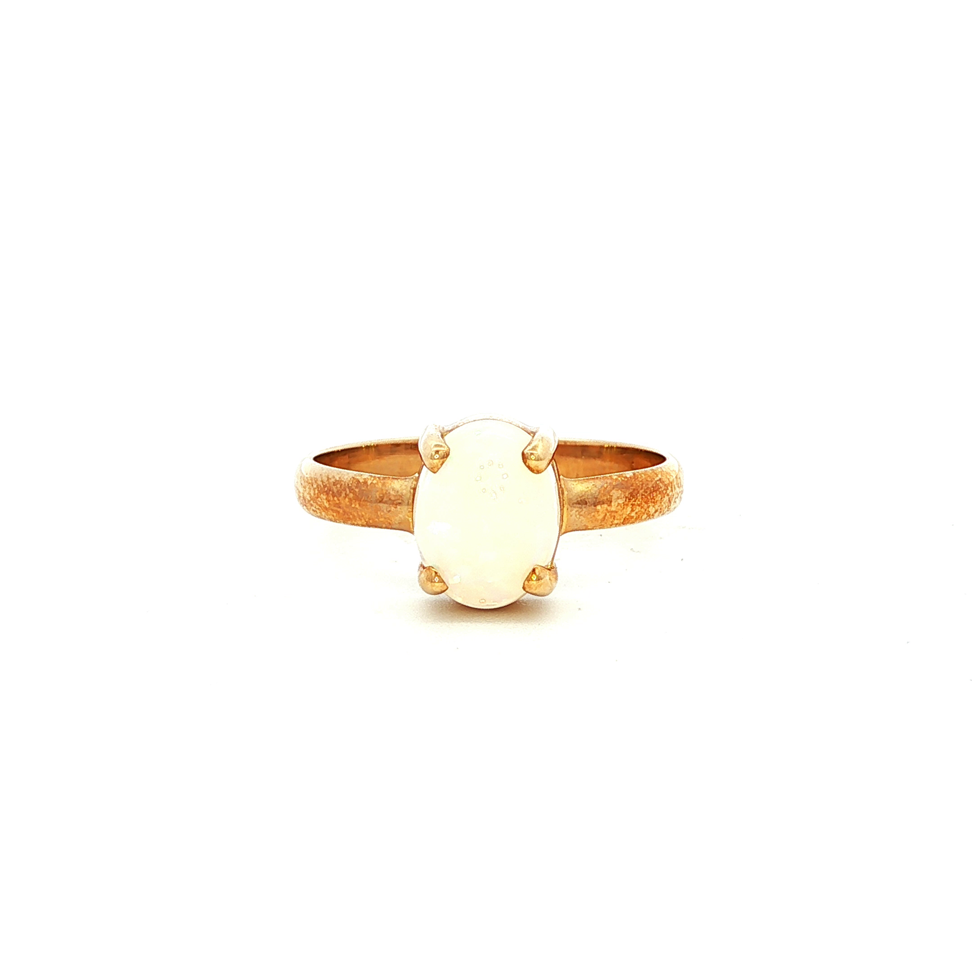 Solid Oval White Opal Ring in Yellow Gold