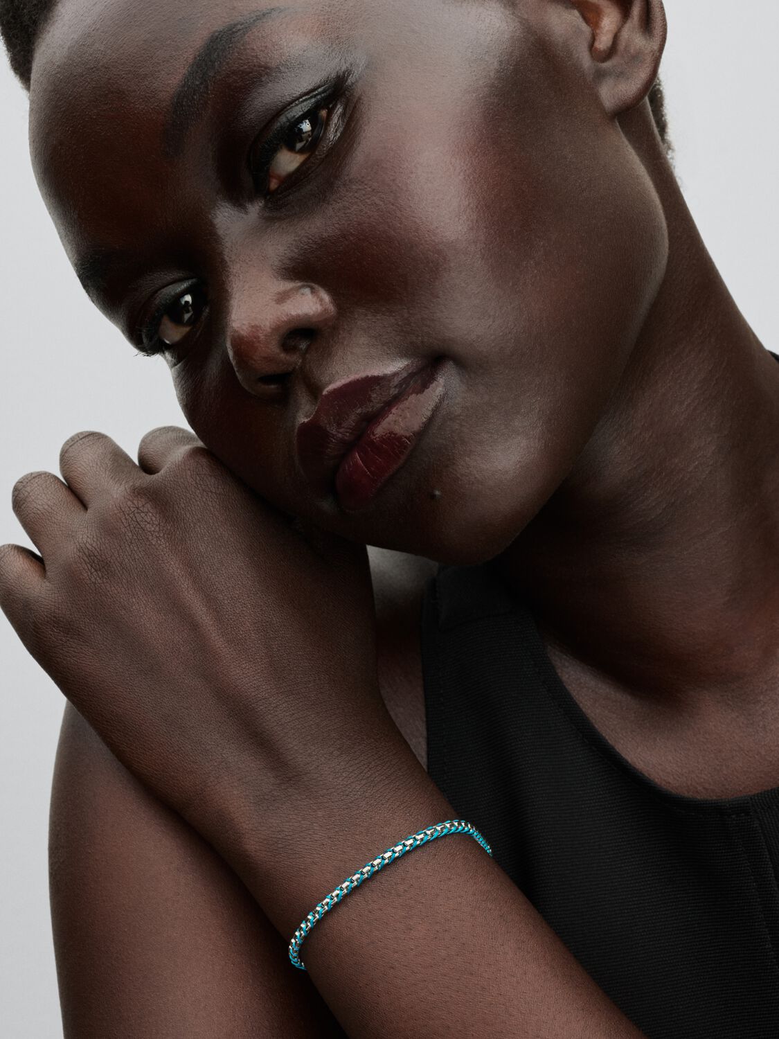 Braided sterling silver box chain bracelet with turquoise textile cord