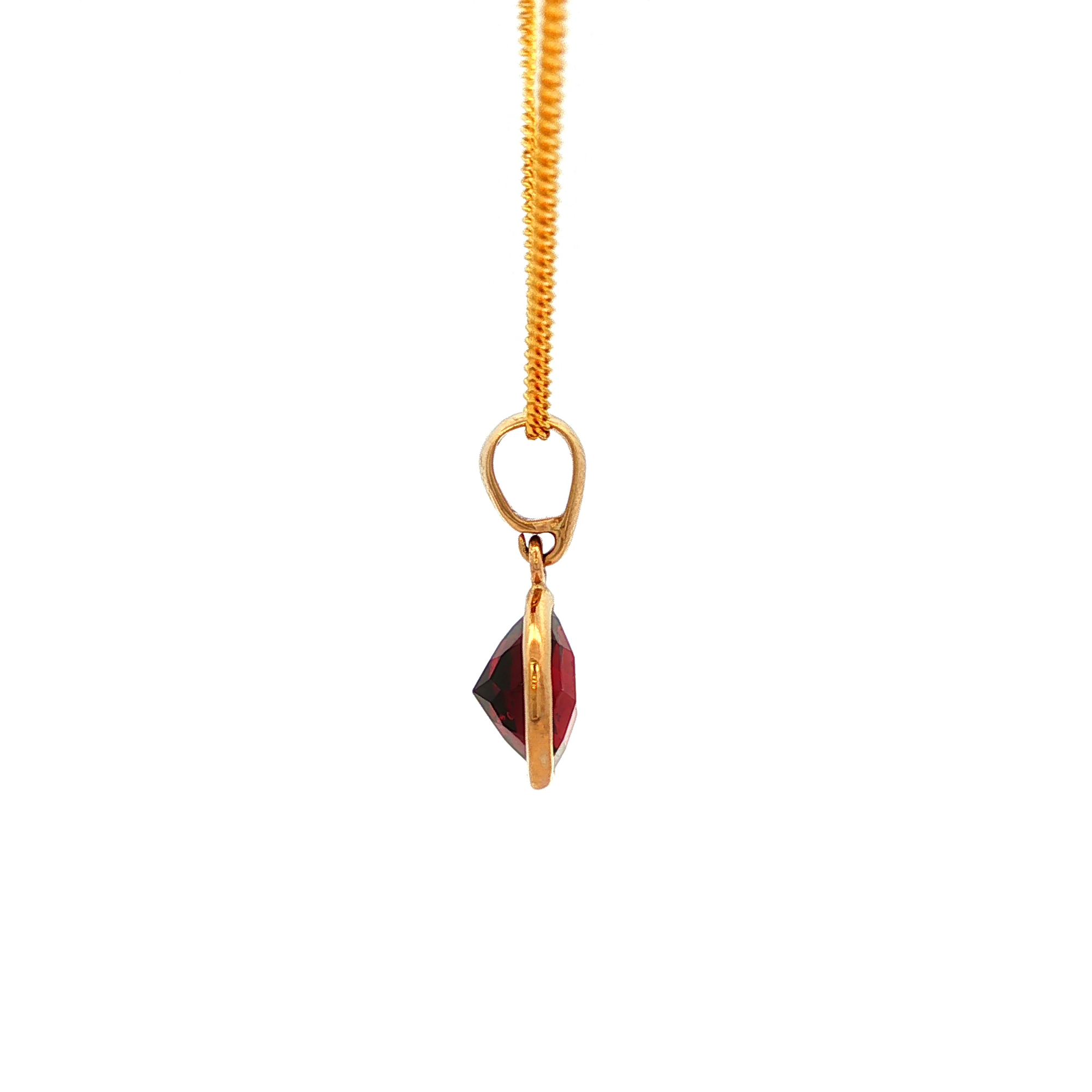 Round Faceted Garnet Pendant in Yellow Gold