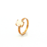 Solid Oval White Opal Ring in Yellow Gold