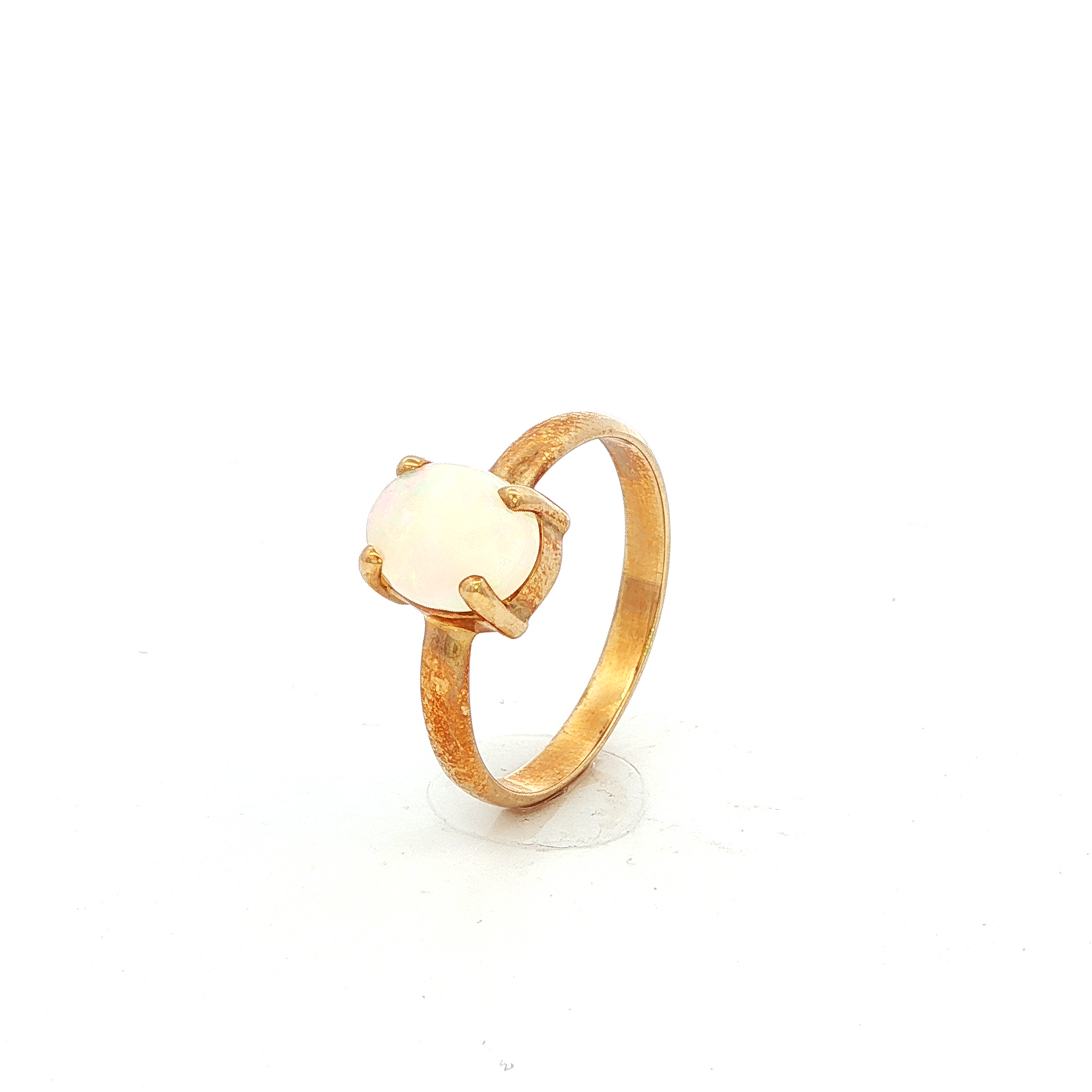 Solid Oval White Opal Ring in Yellow Gold