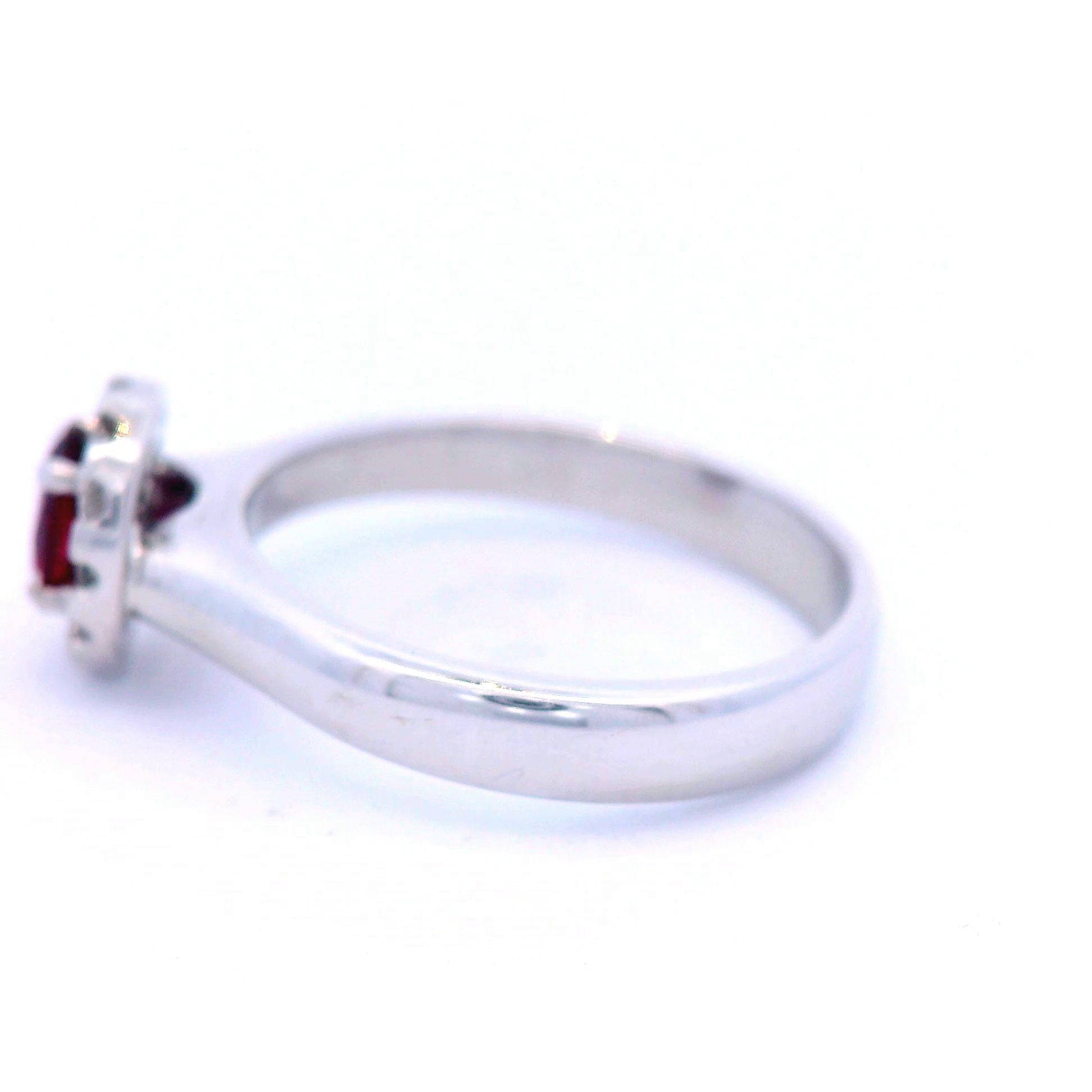 Natural Oval Ruby in White Gold with Round Brilliant Cut Halo Diamond