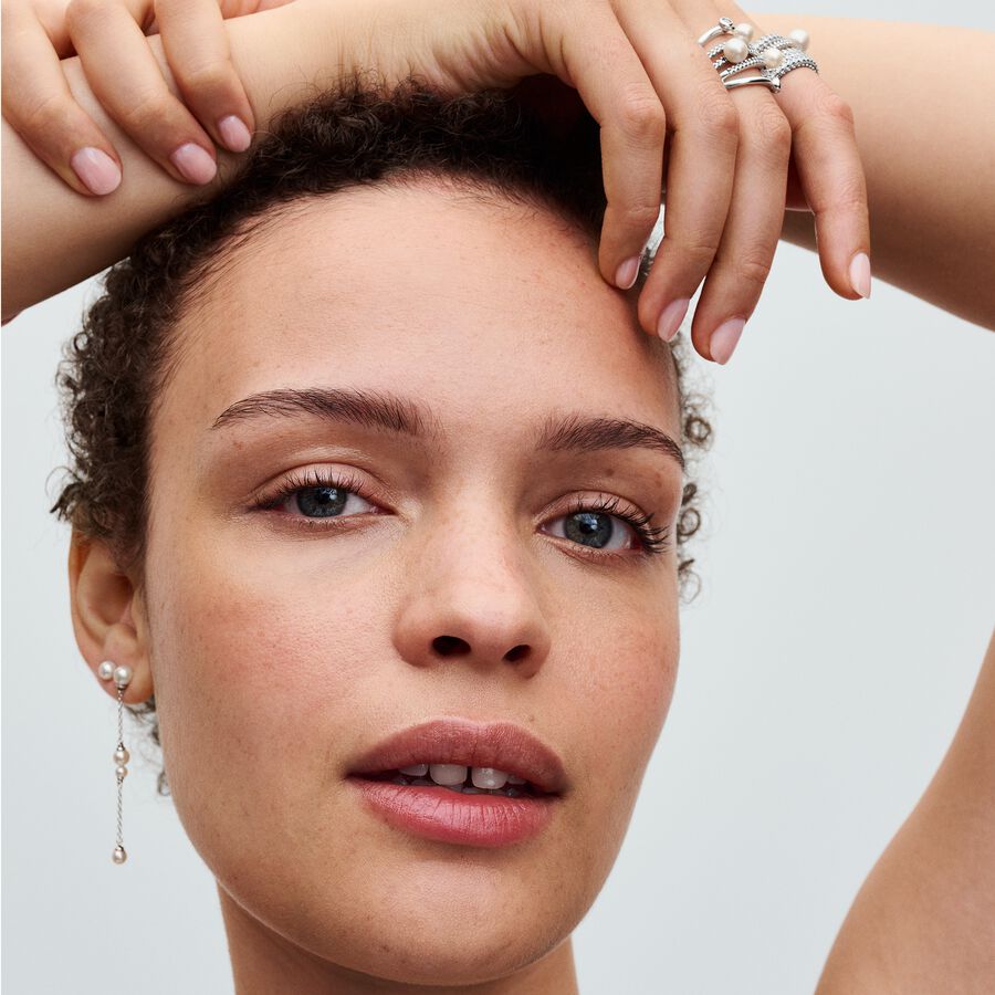 Sterling silver ring with white treated freshwater cultured pearl and clear cubic zirconia