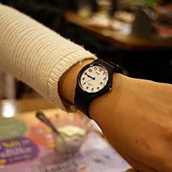 Casio Gents Analogue Watch with White Face, Arabic Numbers, 50 Metres Water Resistant and Black Resin Band.  Model: MW59-7B