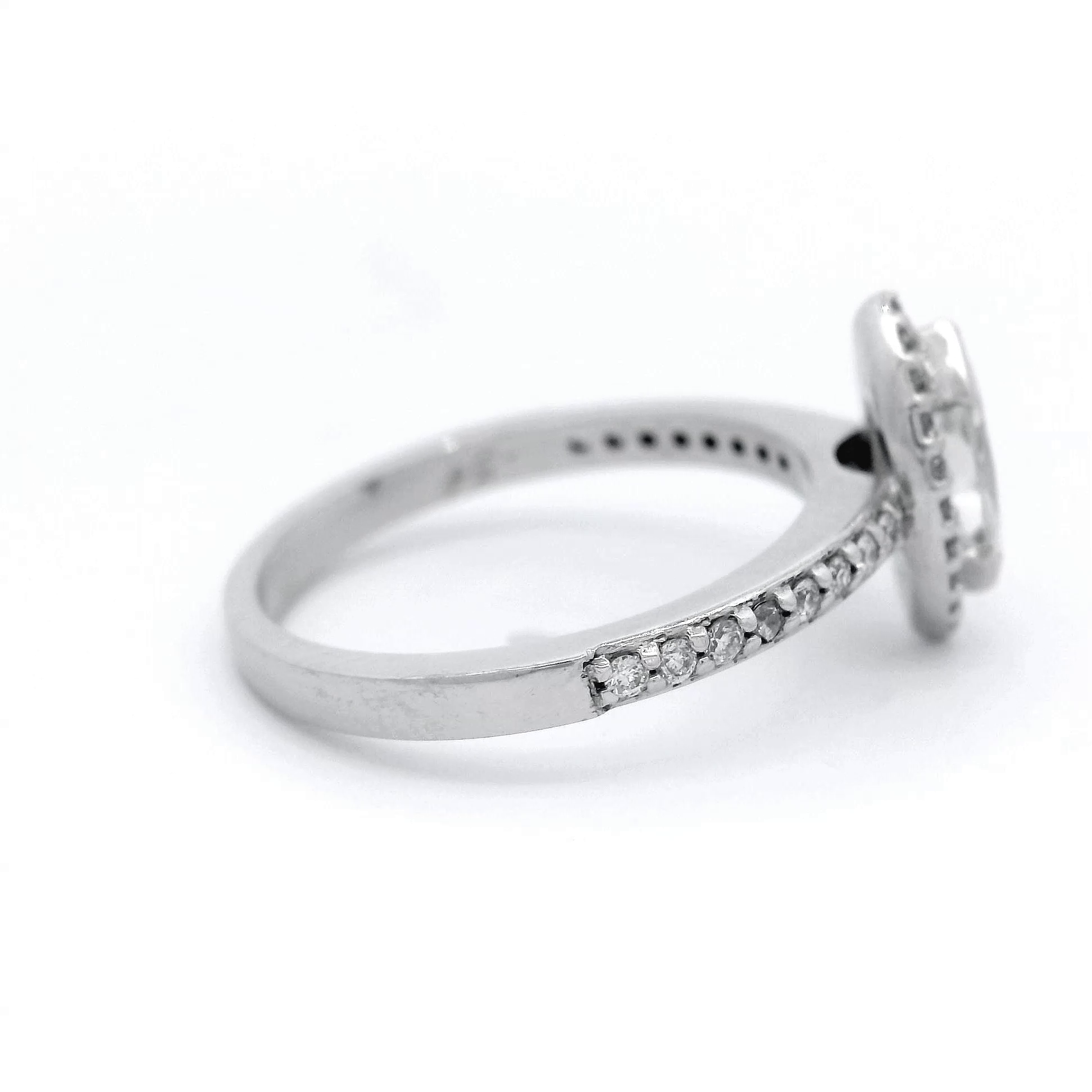 Marquise Diamond and Diamond Halo Engagement Ring in 18 Carat White Gold