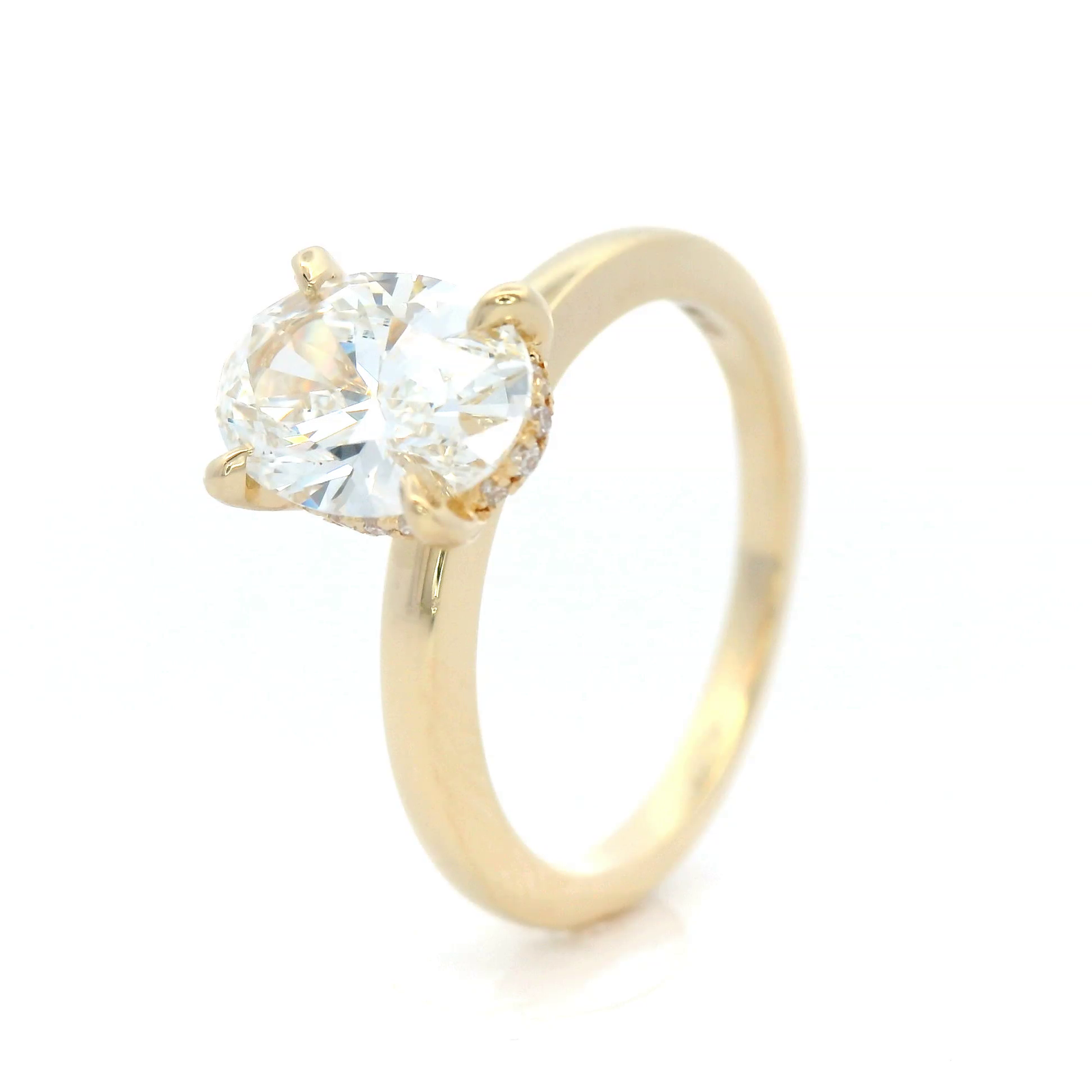 Lab Grown Oval Cut Diamond Engagement ring with hidden diamond set halo in 18 Carat Yellow Gold