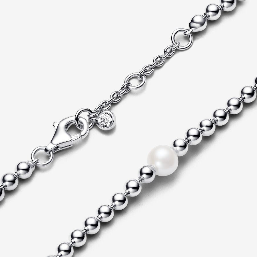 Beaded sterling silver bracelet with white treated freshwater cultured pearl and clear cubic zirconia