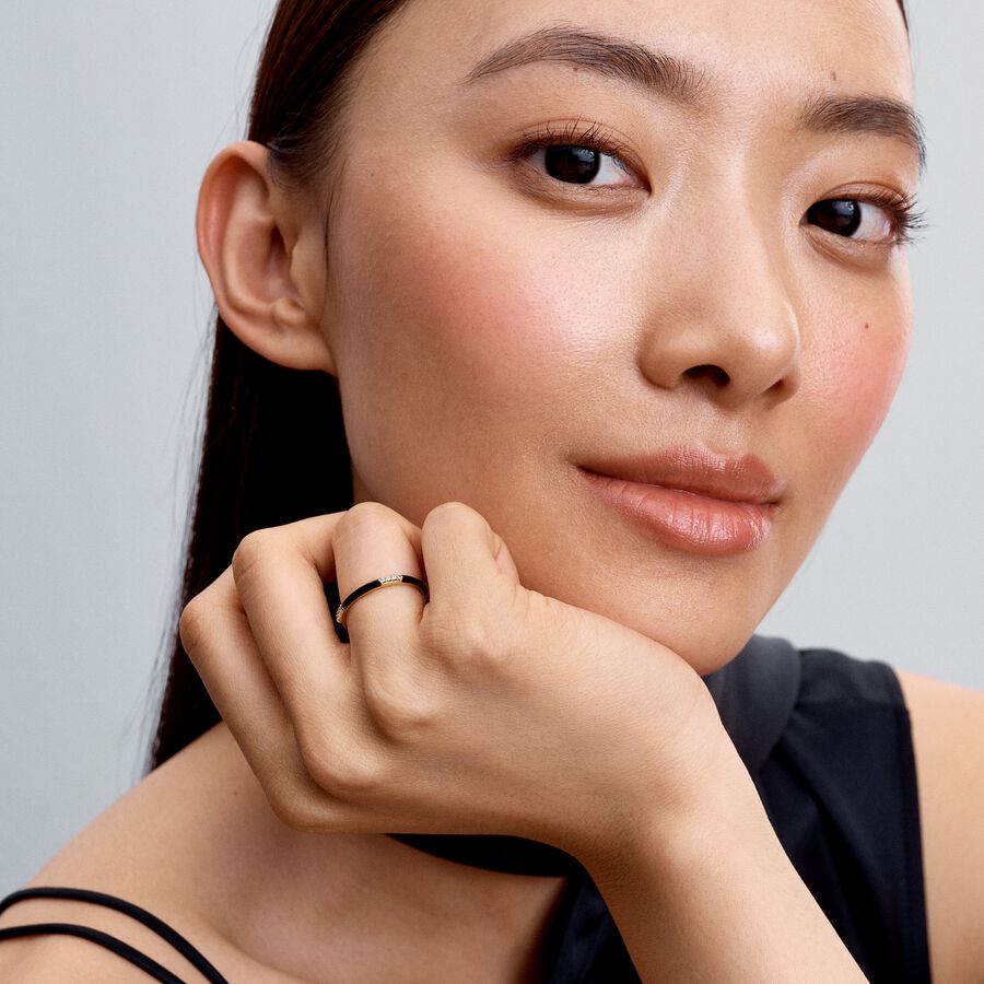 14k Gold-plated ring with clear cubic zirconia and black enamel