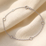 Sterling Silver 4 x Cut-Out Hearts Cable Bracelet
