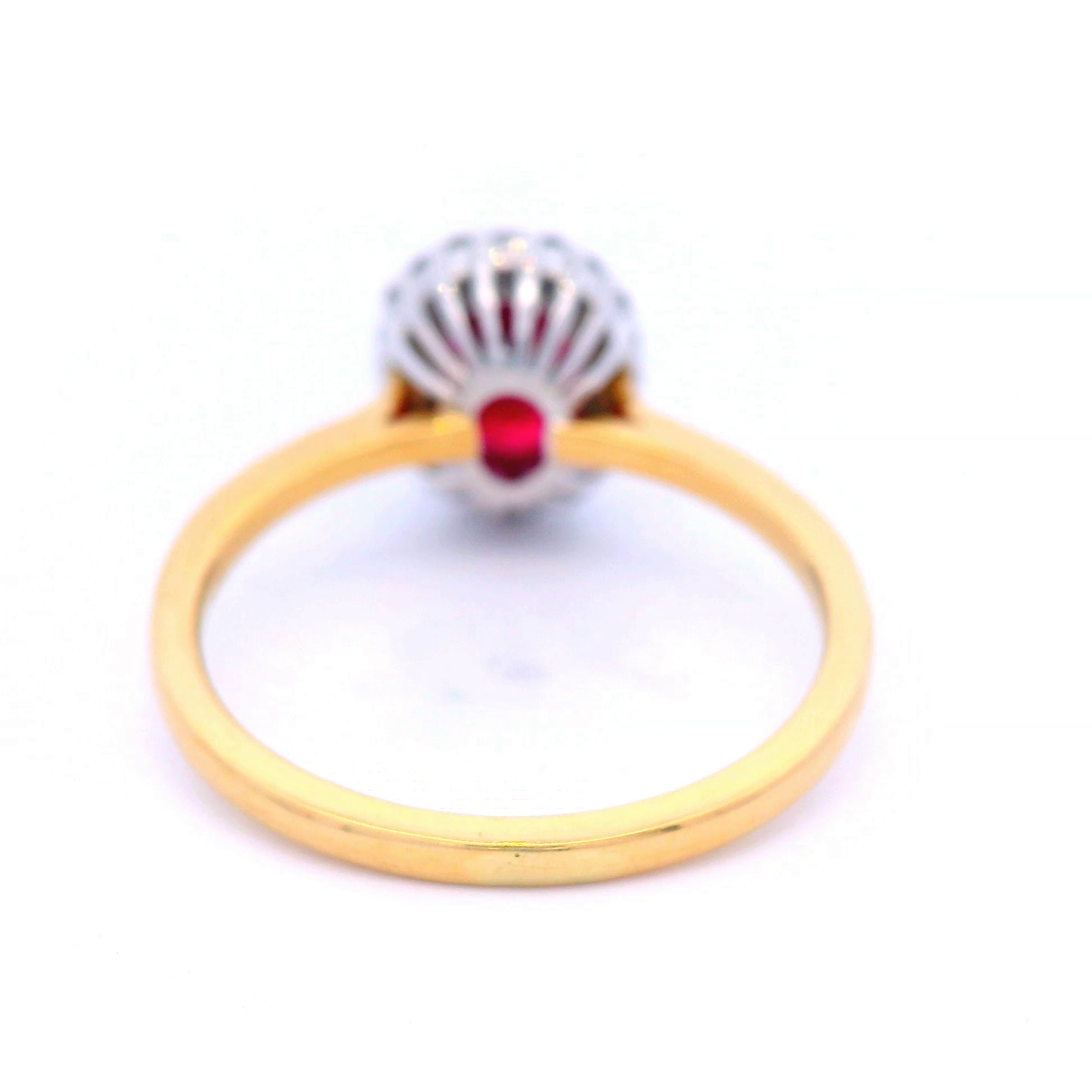 Oval Shaped Ruby with Diamond Halo Cluster in Yellow Gold