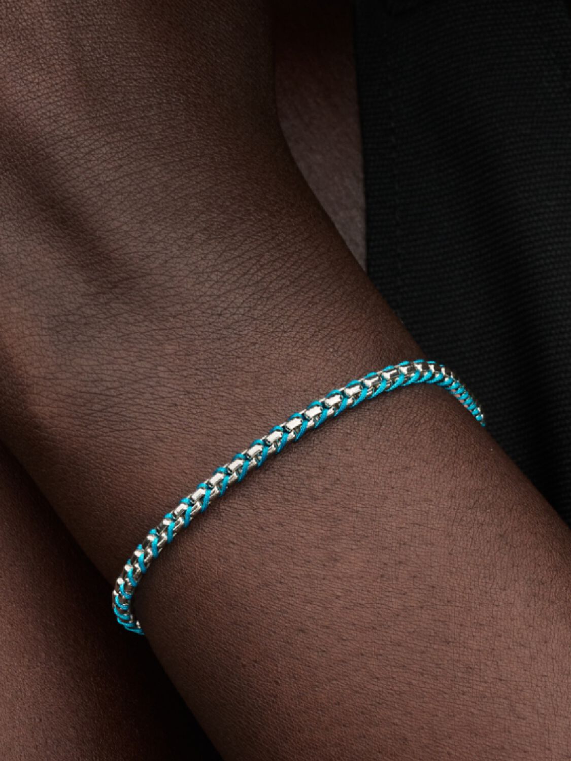 Braided sterling silver box chain bracelet with turquoise textile cord