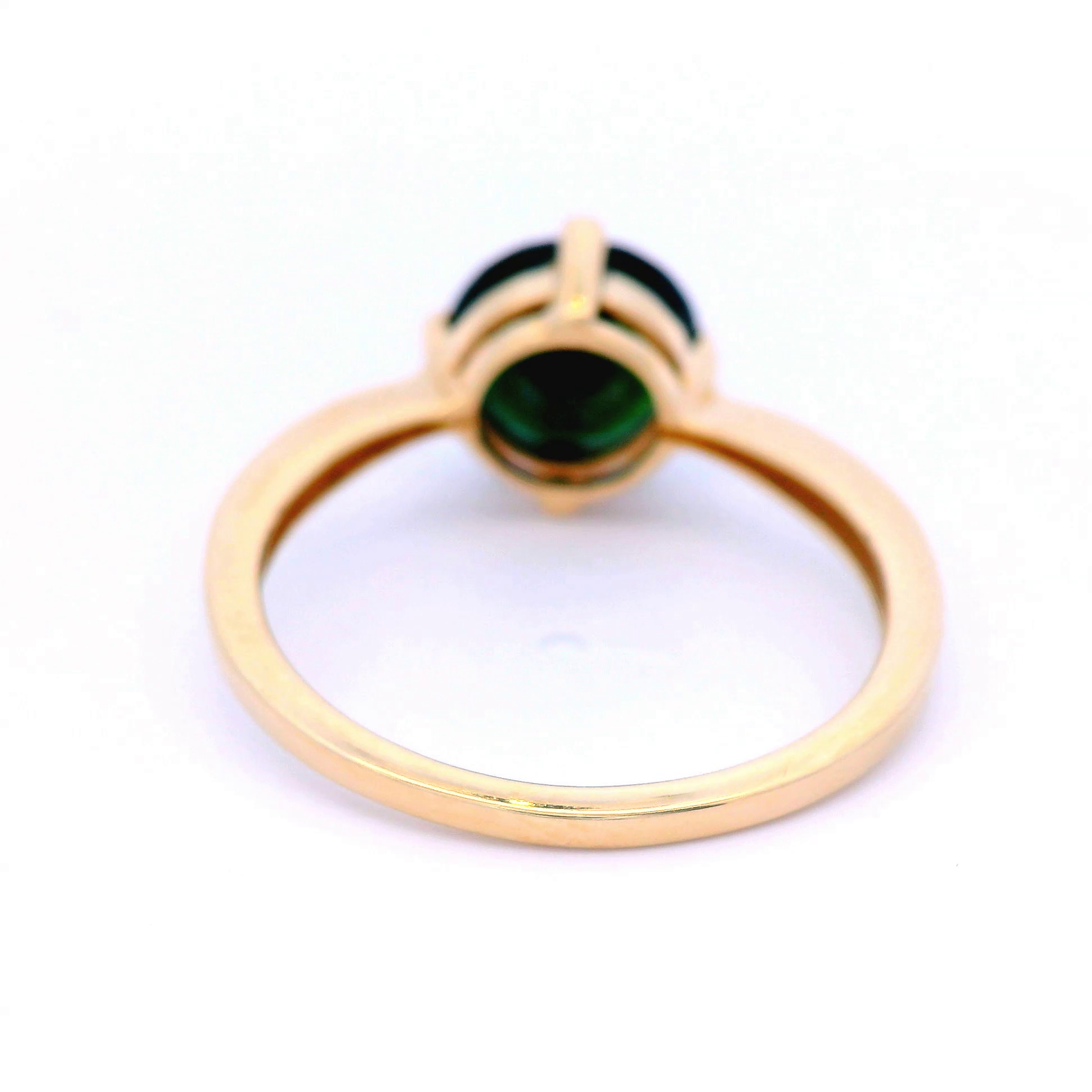 Round Blue/Green Sapphire, set in a 4 claw setting made of 9 Carat Yellow Gold