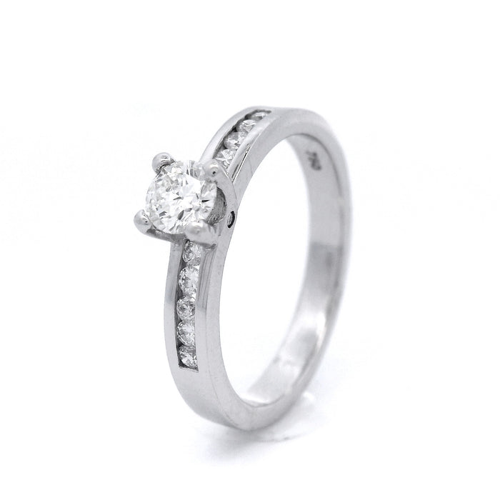 18ct White Gold Brilliant with Channel Set Shoulders