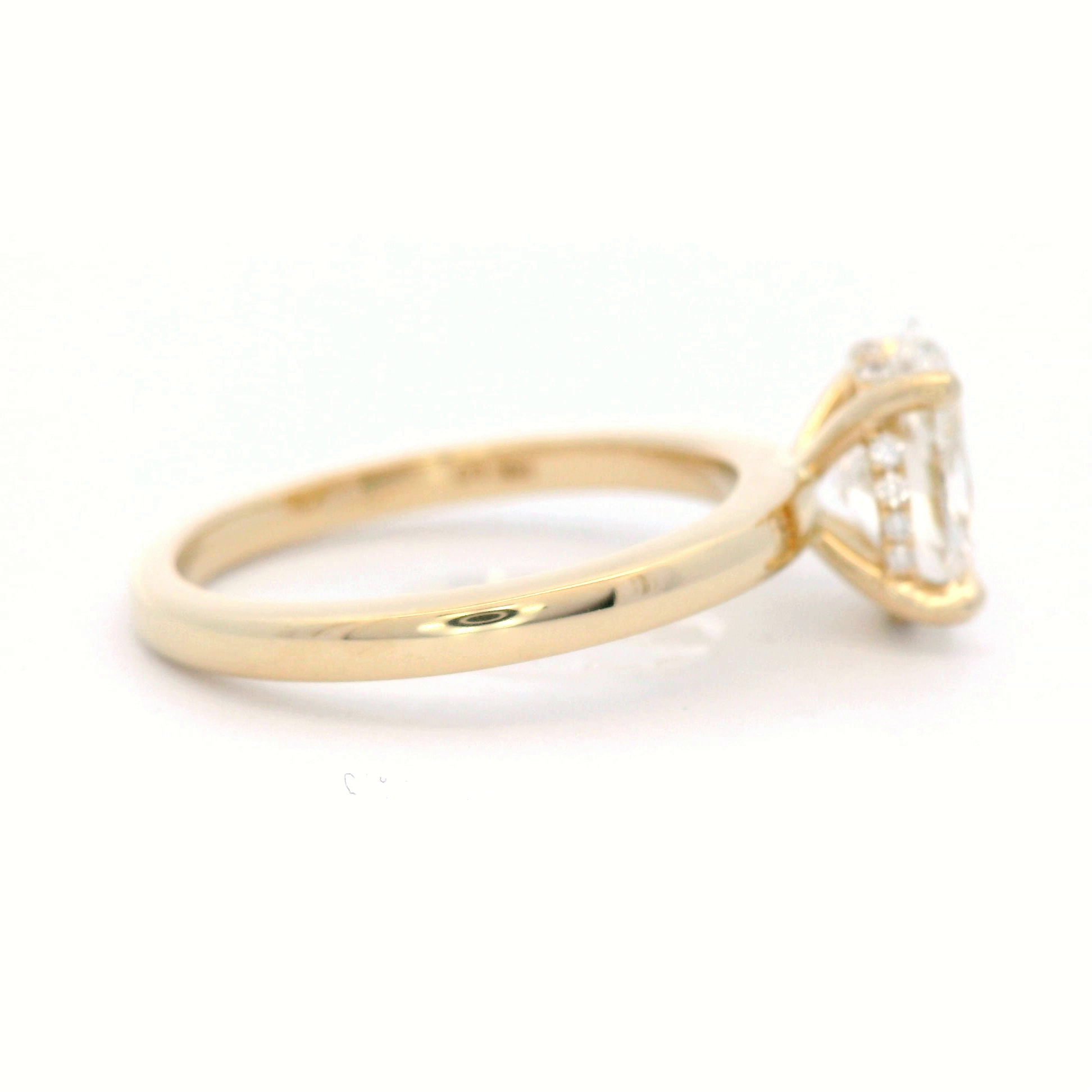 Lab Grown Oval Cut Diamond Engagement ring with hidden diamond set halo in 18 Carat Yellow Gold