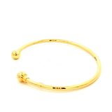 Hollow Ball End Cuff Bangle in Yellow Gold