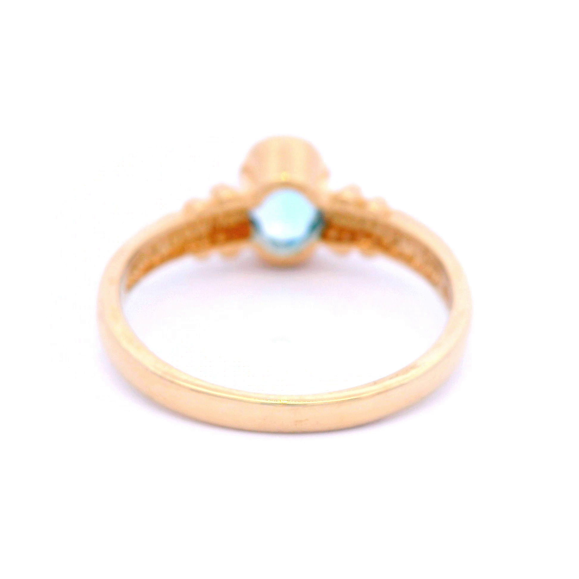 Oval Blue Topaz Set in Yellow Gold