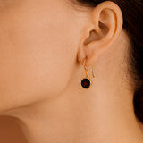 Round faceted Garnet Earrings in Yellow Gold