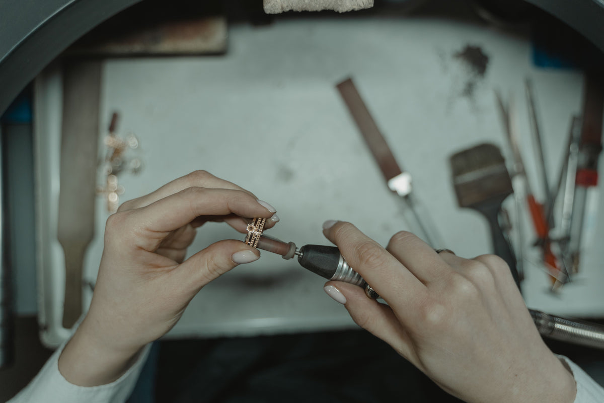 Custom-designed engagement ring being tried on