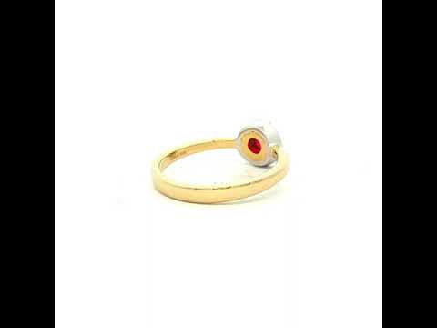 Ruby and Diamond Halo Ring in Yellow Gold
