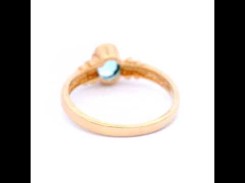 Oval Blue Topaz Set in Yellow Gold